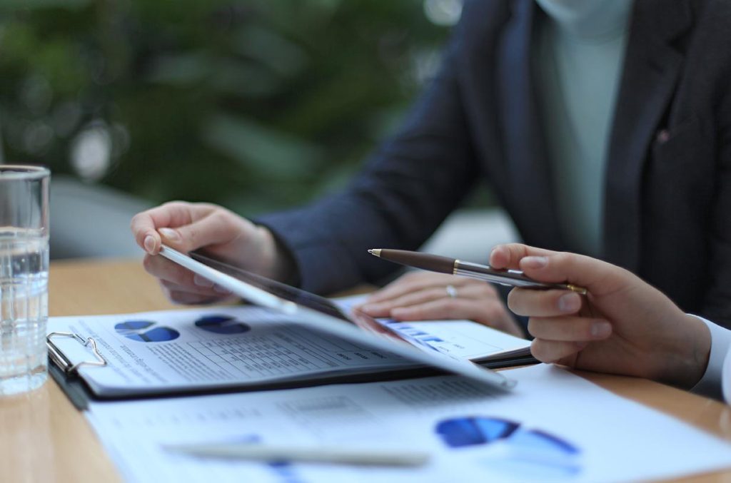 Business people working on spreadsheets